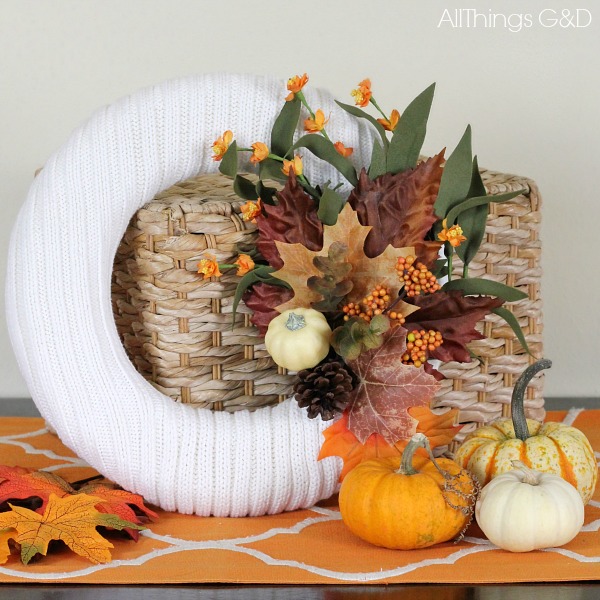 Save your old, ripped or stained cable knit sweaters from the trash or donate pile and turn them into a fall sweater wreath! | www.allthingsgd.com