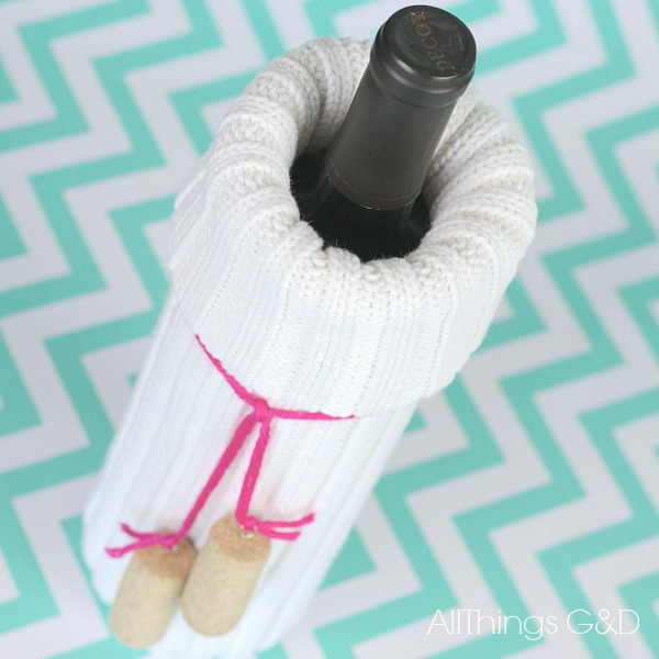 Because sometimes wine just needs a cozy sweater, too...try this easy DIY Wine Bottle Cover made from the sleeve of a sweater.  Makes a wonderful hostess or housewarming gift! | www.allthingsgd.com #wine #gift #hostessgift #housewarminggift #repurpsed #upcycle