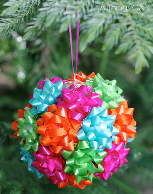 This DIY mini gift bow ornament is the easiest thing you'll make this holiday season.  Enjoy it on your tree or tape to a present for added (and reusable!) flair! | www.allthingsgd.com