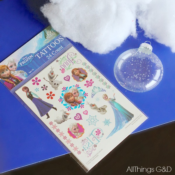 Surprise a Frozen fan on your holiday list with one of these beautiful DIY Frozen Ornaments - it's easier than you think with this amazing trick! | www.allthingsgd.com #Frozen #FrozenOrnament #PrincessElsaOrnament #QueenElsaOrnament #PrincessAnnaOrnament #OlafOrnament