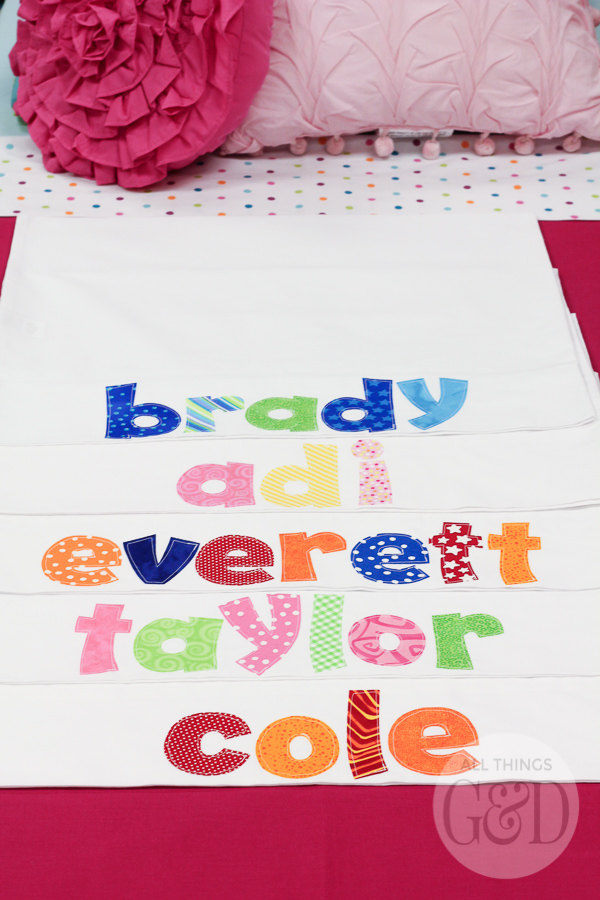 A fun, colorful, and playful polka dot pajama birthday party, including tables dressed to look like beds, personalized pillowcase party favors, doll beds as cookie platters, and a polka dot cake! | www.allthingsgd.com