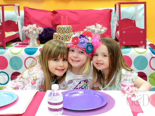 A fun, colorful, and playful polka dot pajama birthday party, including tables dressed to look like beds, personalized pillowcase party favors, doll beds as cookie platters, and a polka dot cake! | www.allthingsgd.com
