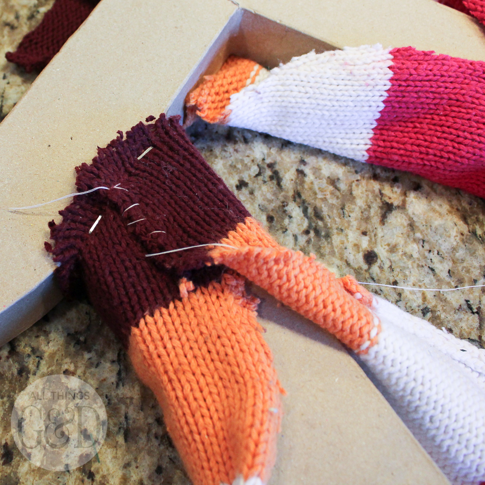 Repurpose an old cable knit sweater into a DIY Sweater Monogram Wreath - makes a great holiday or housewarming gift, or fun winter decor for your front door! | All Things G&D