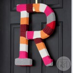 Repurpose an old cable knit sweater to make a DIY Sweater Monogram Wreath. | All Things G&D